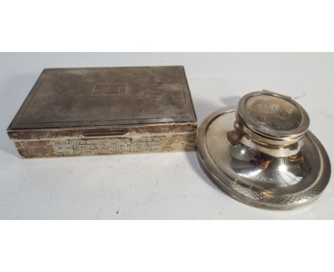 Silver circular capstan inkwell  with inscription dated 1930, and a table top cigarette box with presentation inscription to 