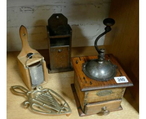 An old coffee grinder, nutmeg grater, brass trivet and an oak match dispenser 