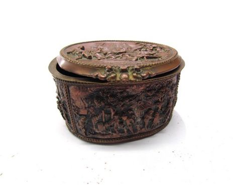 A 19th Century French embossed copper lidded trinket box of oval form with all over figural scenes, marked A.B. to base, miss