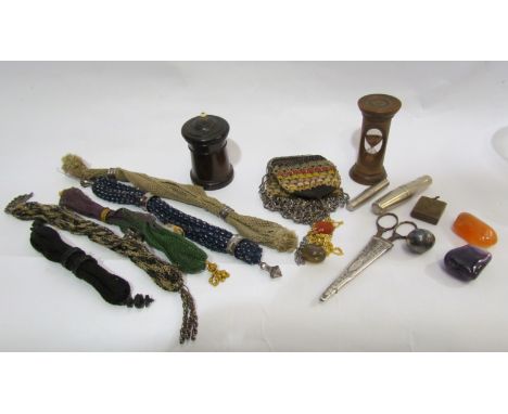 A mixed lot to include a rosewood treen pot, two travel corkscrew, a wooden egg timer, a collection of various miser purses, 