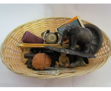 A basket containing miscellaneous items including a cloisonné thimble, Hasbro model racing car, dog page marker, ebony elepha