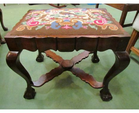 A George II style dressing table stool. The serpentine shape sides &amp; drop in seat over ball in claw cabriole legs joined 