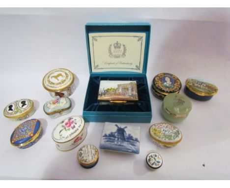 A collection of modern enamel pill boxes to include Halcyon Days examples