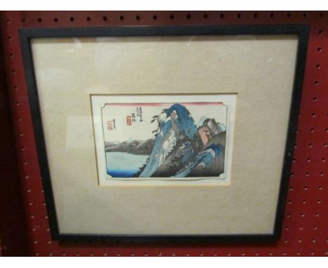 A Japanese woodblock print of mountainous scene, framed and glazed, 10cm x 14cm