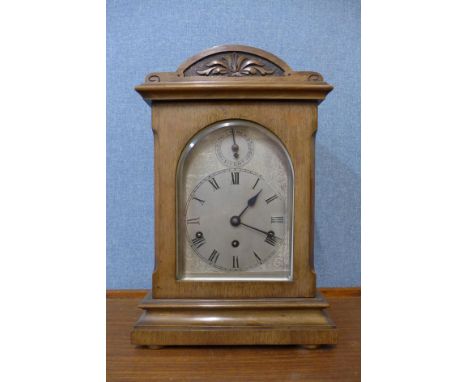 A late 19th Century German Wurttemburg carved walnut bracket clock 