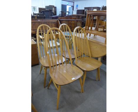 A set of four Ercol Blonde elm and beech Quaker chairs 