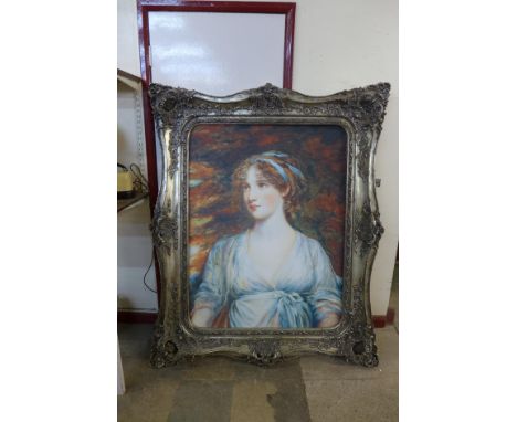 A large portrait print of a lady, framed 
