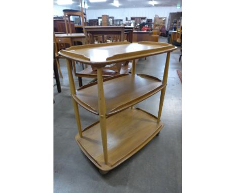 An Ercol Blonde elm and beech Windsor trolley 