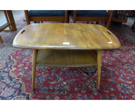 An Ercol Blonde elm and beech butlers tray coffee table 