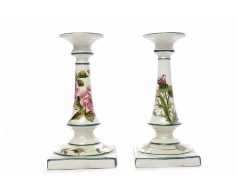 TWO WEMYSS CANDLESTICKS hand-painted with rose and thistle decoration respectively, each with impressed and hand-painted Wemy