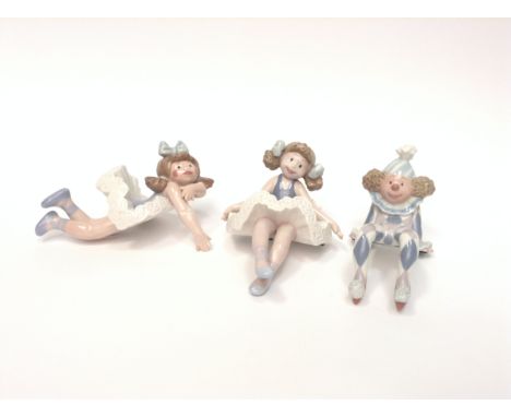 THREE LLADRO SHELF HANGING FIGURESto include Ragamuffin and two ballerina dolls, approximately 9.5cm high (3)