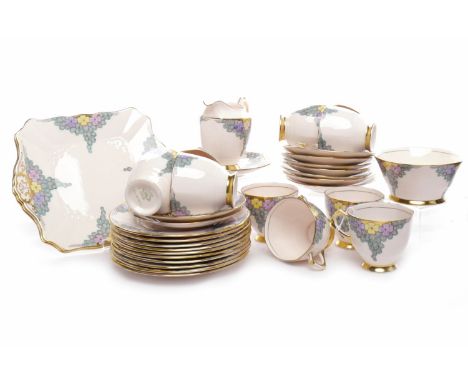 TUSCAN PLANT TEA SERVICEcomprising ten cups, ten saucers, ten side plates, two cake plates, milk jug and sugar bowl, pattern 