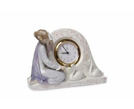 LLADRO MANTEL CLOCK MODELLED WITH YOUNG WOMAN AND SWANSimpressed 5777, H-8, approximately 18cm high, 25cm wide