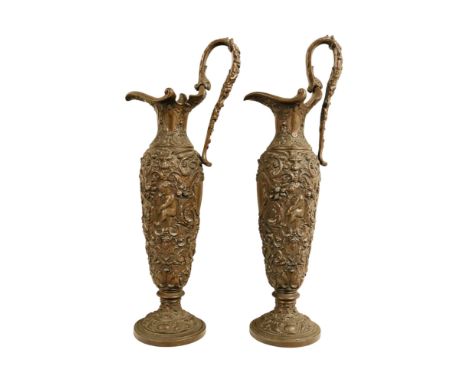 A late 19th century cast spelter renaissance style ewer - decorated in low relief with strapwork putto and a vacant cartouche