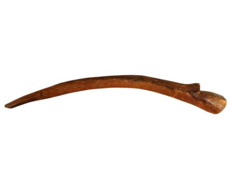 A primitive African hardwood club - bow shaped with a notched head, 56cm long.