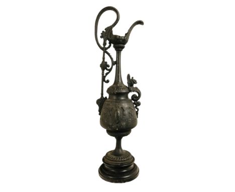 An early 20th century Italianate cast spelter ewer - decorated with a griffon mask, 60cm high.