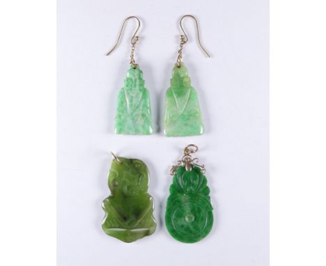 A carved jade pendant - with a 9ct gold frame, together with a pair of ear pendants and another carved pendant.