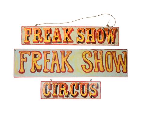 A painted pair of signs forming - 'Circus Freak Show' in showman's font on a light blue ground, together with another 'Freaks