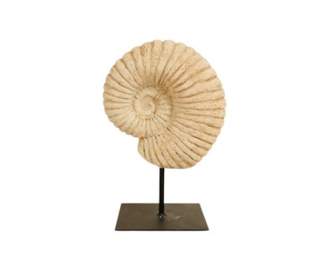 A resin cast ammonite - mounted on a post, 25cm high.