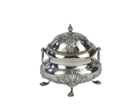 A small bombe shaped silver caddy - London 1899, of oval form with twin drop handles, on claw pad feet, 139g.