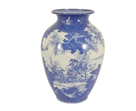 A large Meiji period blue and white vase - of squat baluster form, decorated with cranes, flowers and foliage in an extensive