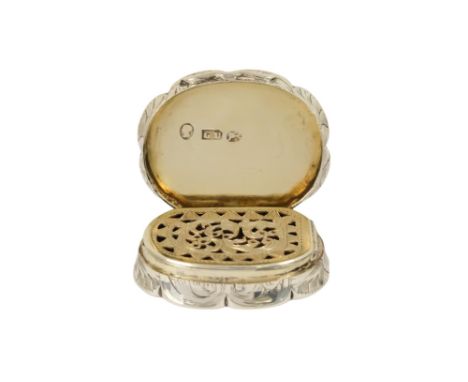 A silver vinaigrette - Birmingham 1855, George Unite, of oval scalloped form decorated with engine turning, the interior fitt