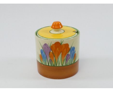 A Clarice Cliff 'Crocus' pattern drum shape preserve pot and cover - Bizarre Newport Pottery marks, height 9cm.