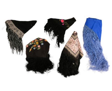 An early 20th century black piano shawl - embroidered with flowers with a long fringe, together with a blue shawl and three o