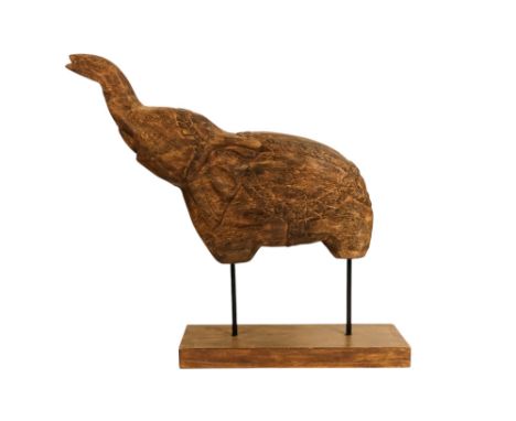 A carved hardwood elephant - with trunk raised, mounted on a rectangular base, 48cm high.
