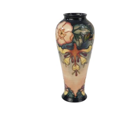 A Moorcroft baluster shaped vase - circa 1993, tube-line decorated with honeysuckle, 12cm high.