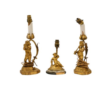 A pair of early 20th century Italian carved gilt wood table lamps - modelled as cherubs playing musical instruments, on a ste