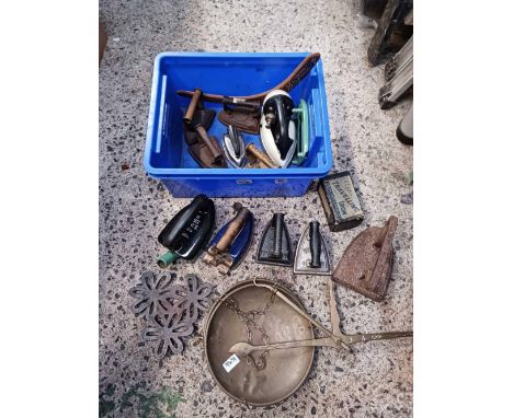 CARTON WITH MISC VINTAGE FLAT IRONS, BOOMERANG, TRIVETS &amp; SET OF BRASS SCALES