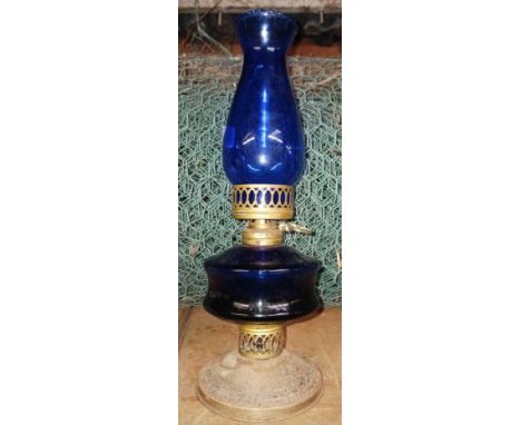 SMALL GOLD COLOURED METAL OIL LAMP WITH BLUE RESERVOIR 
