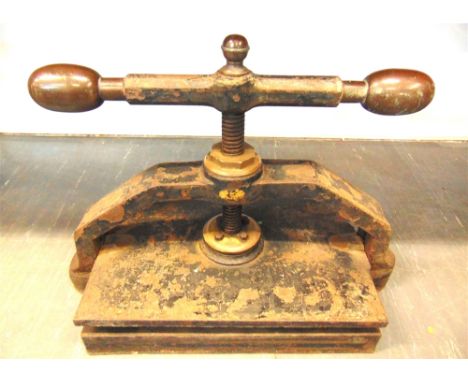 A CAST IRON &amp; BRASS PORTABLE BOOK PRESS  painted black, the pressing plate area 31cm x 45.5cm.