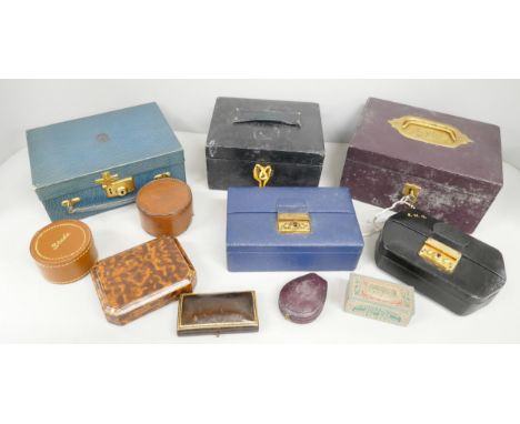 A collection of vintage leather covered jewellery boxes with keys, etc.