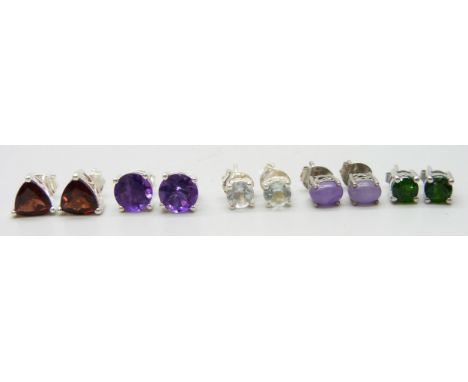 Five silver and precious stone set stud earrings, set with mozanite garnet, aquamarine, purple jade, chrome diopside, and Zam