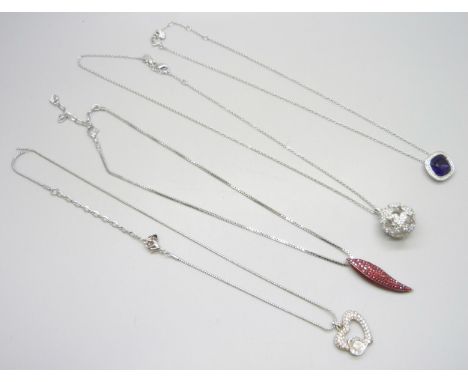 Four Swarovski pendants on chains 