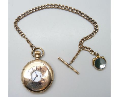 A gold plated Pinnacle half hunter pocket watch, and an Albert watch chain with T bar and spinning fob