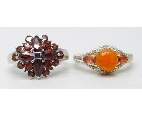 Two silver rings, one set with Ethiopian orange opal, sapphire and diamond 1.25ct, O/P, and the other set with 2.45ct mozanit
