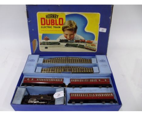 A Hornby  Dublo EDP15 boxed set, comprising 2-6-4 engine, three D13 Suburban coaches and track, box inserts good with one sma