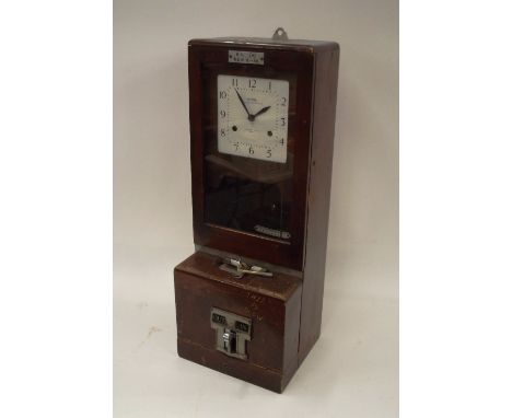 A time clock, labelled BR (M) REB 8-38, National Time Recorder Limited, complete with key and pendulum