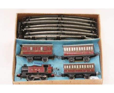 A Hornby No.101 LMS tank passenger set, comprising 0-4-0 C/W engine, maroon 2270, 2 coaches and brake van with track, box ins