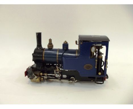 A Roundhouse 0-4-0 gas fired live steam engine, with radio controls and transmitter, cab roof loose to facilitate radio opera