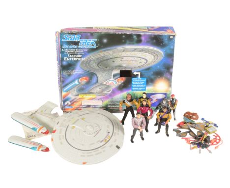 Star Trek - A collection of 1992 Star Trek: The Next Generation ship and action figures by Playmates Toys. Includes a boxed C