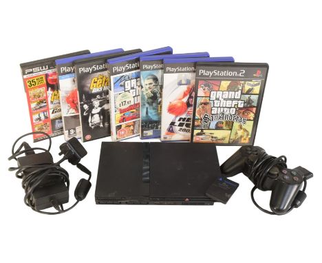 Retro Gaming - a vintage Sony PS2 Playstation 2 slim video game consoles together with controllers and games comprising; Gran