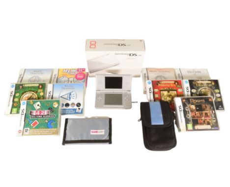 Gaming - a boxed Nintendo DS Lite hand held video game console together with a selection of strategy / braintraining games. T