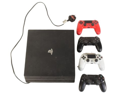 Gaming - an original Sony PS4 Playstation 4 video game console together with x4 wireless controllers.