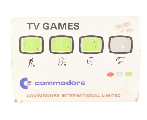 Retro Gaming - a vintage 1970s Commodore 2000K TV Game video game console with x4 paddle controllers, power unit and built in