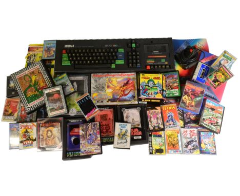 Retro Gaming - a vintage 1980s Amstrad CPC 464 keyboard, joystick controller and a large selection of gaming cassettes to inc
