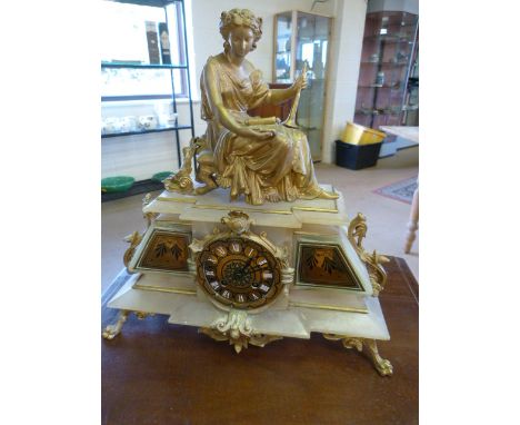 French style Alabaster and Ormulu decorated mantle clock by John Bennett Cheapside London.  Clock sat on gilt lions feet with